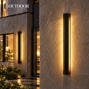 LumaLine Stainless outdoor wall light on a rain-soaked facade