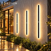 Sentinel motion sensor wall light illuminating a rainy exterior